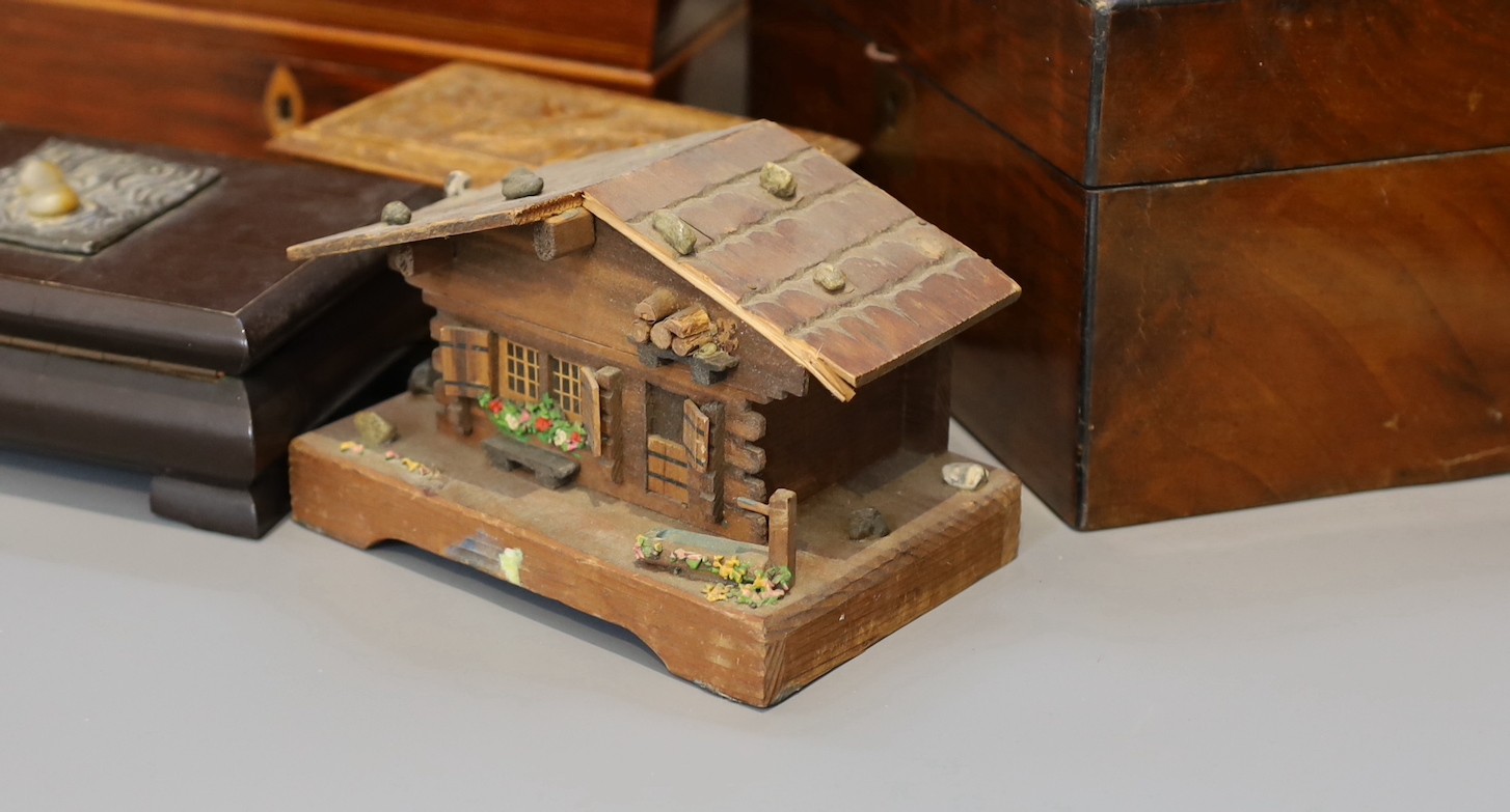 A Victorian mahogany sarcophagus work box, width 30 cms, a Victorian walnut sewing box and three others.